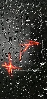 Raindrops on window with glowing orange neon lights.