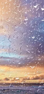 Raindrops on glass with ocean sunset in the background.