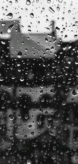 Black and white raindrop wallpaper with a blurred background.