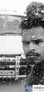 Black and white portrait with rain effects on a car window.