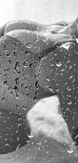 Grayscale abstract wallpaper with raindrop effect on glass.