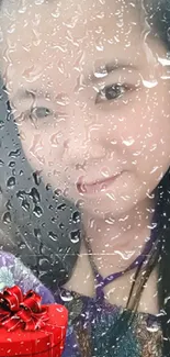 Raindrop-covered window with a woman's portrait.