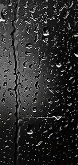 Mobile wallpaper with glistening raindrops on a dark reflective surface.