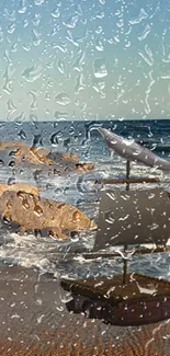 Toy sailboat on rainy seaside beach wallpaper.