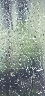 Raindrops streaming on a glass surface, creating a calming effect.