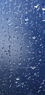 Rain droplets on a blue glass surface for mobile wallpaper.