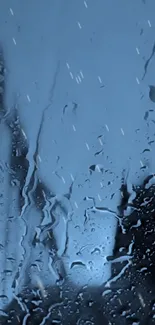 Mobile wallpaper with raindrops on glass in blue tone.