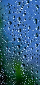 Mobile wallpaper with raindrops on blue glass surface creating a calming effect.