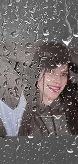 Mobile wallpaper with raindrops on glass and a portrait visible through them.