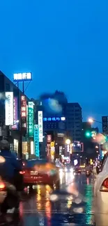 Rainy city street at night with neon signs and reflections.