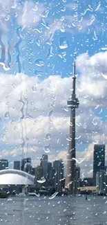 City skyline with raindrops on glass, featuring a prominent tower.