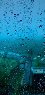 Raindrops on window with a blue backdrop.