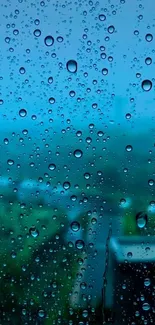 Raindrops on a window with a blurred outdoor view.