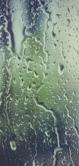 Raindrops on a window create a serene mobile wallpaper.