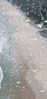 Serene ocean view through rainy glass with water droplets.