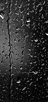 Raindrops on dark glass surface, creating a stylish and moody phone wallpaper.