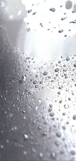 Mobile wallpaper with water droplets on glass surface in gray tones.