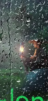 Rainy wallpaper with person holding a lantern.