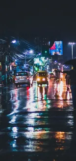 Rainy city street at night with glowing reflections.