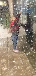 Child's reflection on a rain-speckled window for mobile wallpaper.