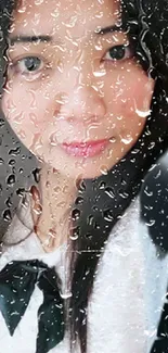 Portrait behind a rain-streaked window on mobile wallpaper.