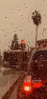 Rain-speckled window overlooking traffic with palm trees.