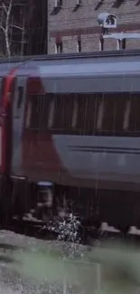 Train moving in the rain with an urban background in gray tones.