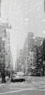 Rainy black and white city street wallpaper with raindrop details.