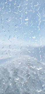 Wallpaper of raindrops on a window with a view of the sky.