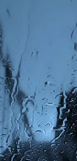 Rain-covered window with blue tones, perfect for calm phone wallpaper.