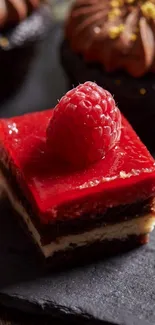 Close-up of a vibrant raspberry dessert with rich red layers on a plate.