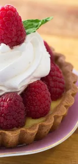 Raspberry tart with cream on a wooden background, perfect for dessert lovers' wallpaper.