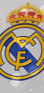 Real Madrid club emblem with crown on a mobile wallpaper.