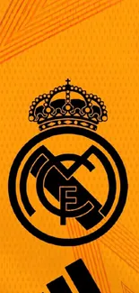 Real Madrid club logo on an orange background wallpaper.