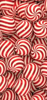 Vibrant red and white candy swirl wallpaper design.