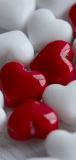 Red and white heart shapes creating a charming phone wallpaper.