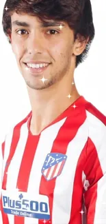 A person wearing a red and white striped jersey with sponsor logos.