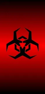 Red wallpaper with black biohazard symbol.
