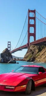 Red sports car with Golden Gate Bridge in the background on a sunny day.