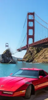 Red sports car near the Golden Gate Bridge with clear blue skies.