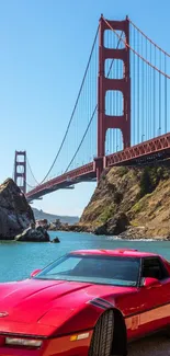 Red car by Golden Gate Bridge with scenic bay view.