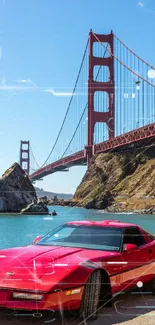 Red car in front of Golden Gate Bridge on a sunny day.