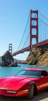 Red sports car with Golden Gate Bridge background.