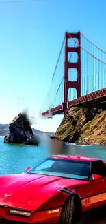 Red sports car in front of Golden Gate Bridge with blue sky.