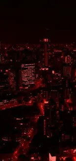 Stunning red-lit cityscape at night with skyscrapers and glowing urban atmosphere.