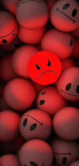 Red wallpaper with emoji faces, one frowning among many smiling.