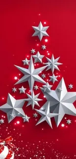 Festive wallpaper with silver stars on a bright red background.