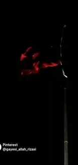 Red flag waving on a black background.