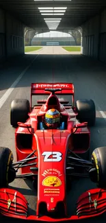 Vibrant red Formula One car on racing track, perfect for motorsport enthusiasts.