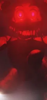 Glowing red animatronic in dark misty atmosphere.